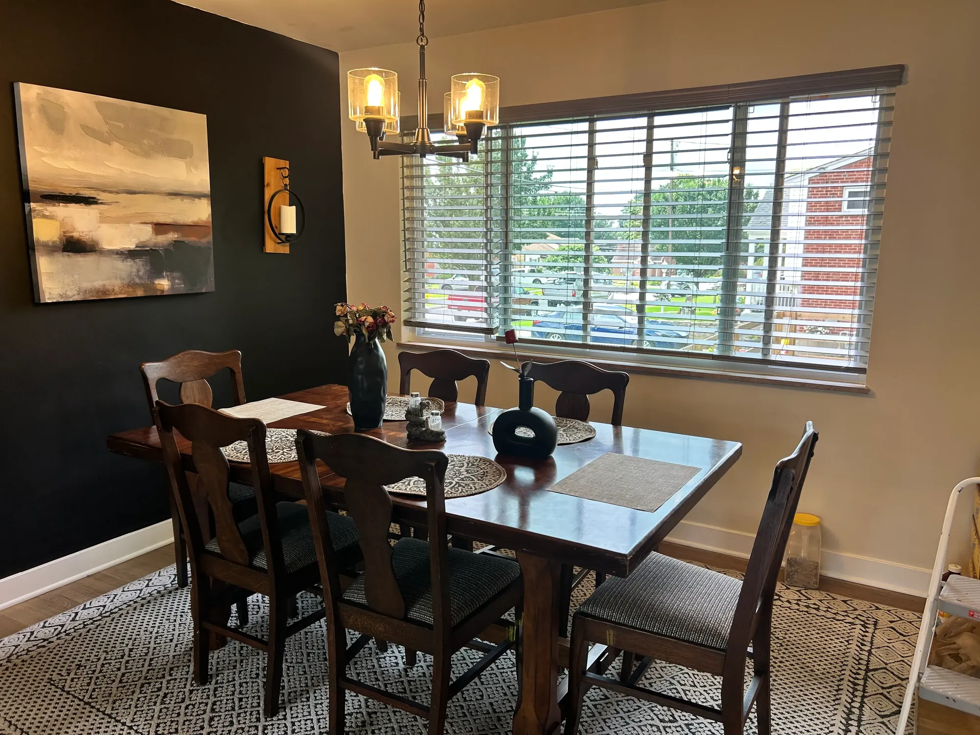 Clean, styled dining room with a dark wood table after a home cleaning in Cincinnati