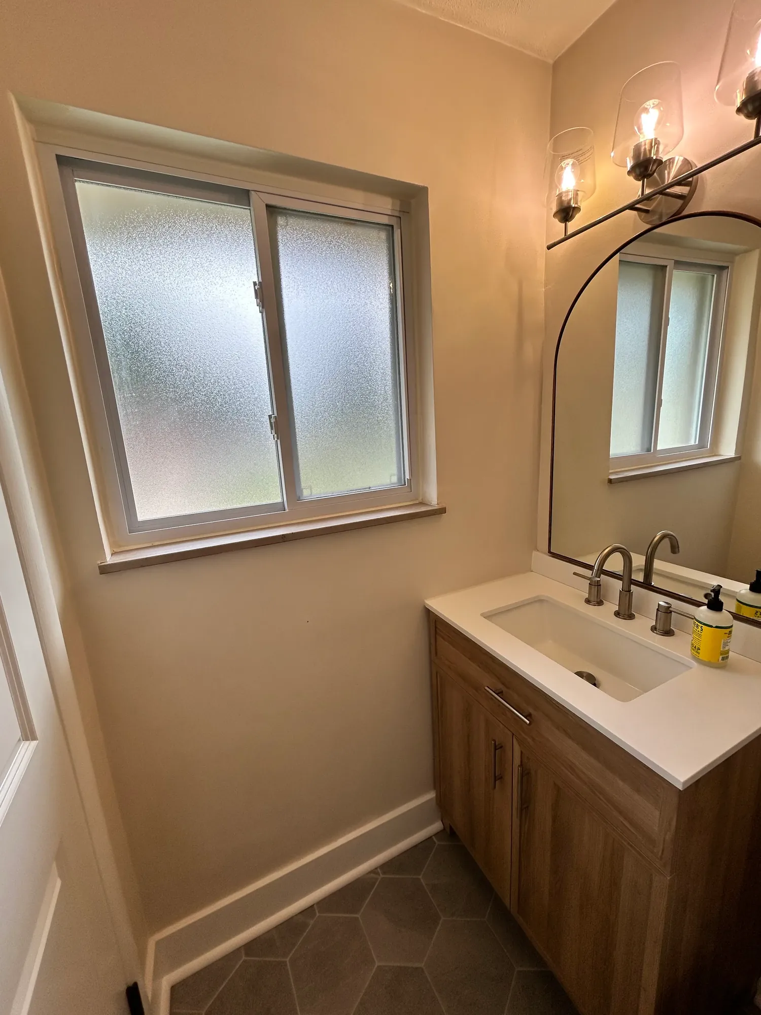 Fresh move-in-ready powder room with a clean wood vanity in Cincinnati